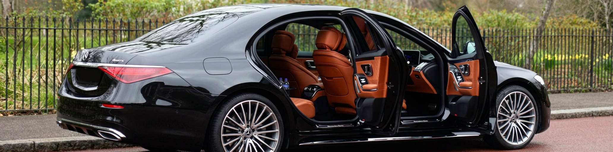 Black executive car on a quiet London street